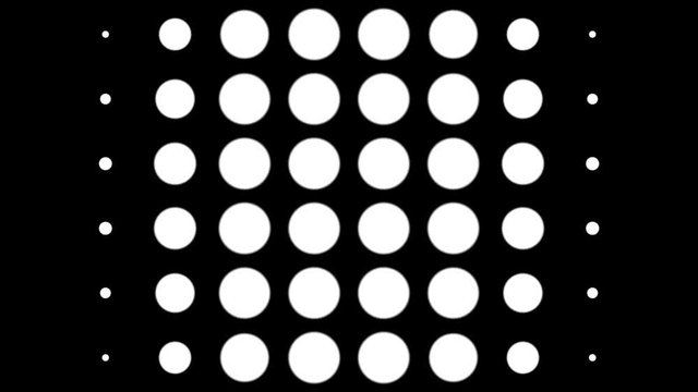 Seamless halftone white dots appear and disappear in motion at black background. Vintage pattern animation.