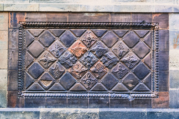 Beautiful traditional Spanish wall decoration made of baked clay tiles. Traditional Spanish pattern used for wall clay decoration.
