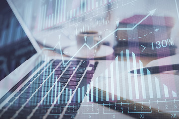 Double exposure of financial chart drawing and desktop with coffee and items on table background. Concept of forex market trading