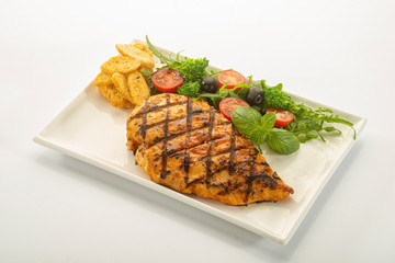 Italian style marinated chicken breast with fresh salads and tomato catchup on a white rectangle plate