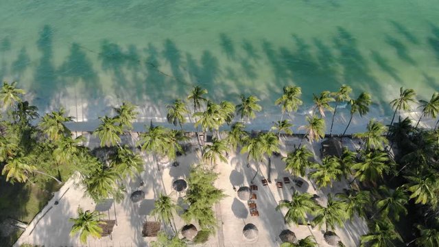 Aerial view of Thatched roof of luxury ocean view resort at the beautiful white sand ocean coast in Paje at Zanzibar island, Tanzania