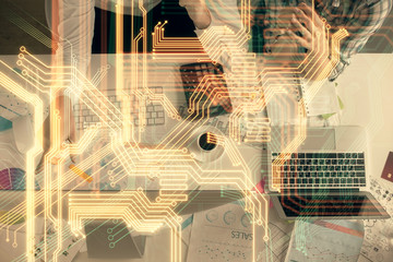 Double exposure of man and woman working together and technology theme drawing. Computer background. Top View. High tech concept.