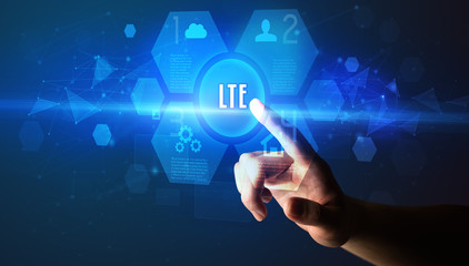 Hand touching LTE inscription, new technology concept