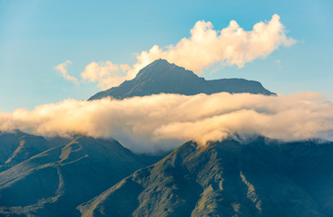 The high altitude Andes mountain peak of the Cotacachi volcano at sunset near Otavalo and north of...