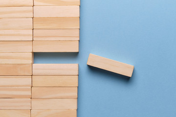 Concept of business loss. Wooden blocks on a blue background.