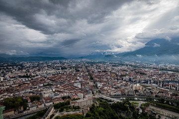 Fototapeta premium View from the Fort de La Bastille looking down on Grenoble with the Cours Jean Jaurès stretching straight into the horizon
