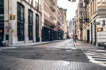 Fototapeten Empty street at sunset time in SoHo district in Manhattan, New York © Nick Starichenko