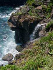 Tajima Waterfalls in Izu, Japan. After flowing through Izu-kogen (lava plateau) the river directly pours down into the sea over the cliffs of the Jogasaki Coast.