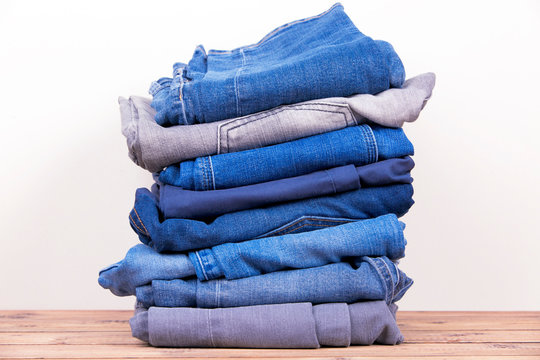Lots of denim pants, blue and gray
