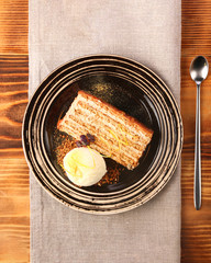 chocolate cake with ice cream tasty dessert with dessert spoon closeup top view on textile