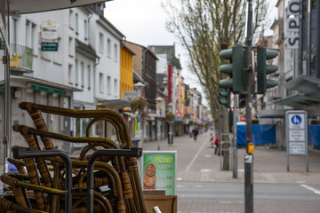 Neuwied, Germany - April 3, 2020: empty place and closed shops in the city center of Neuwied based...
