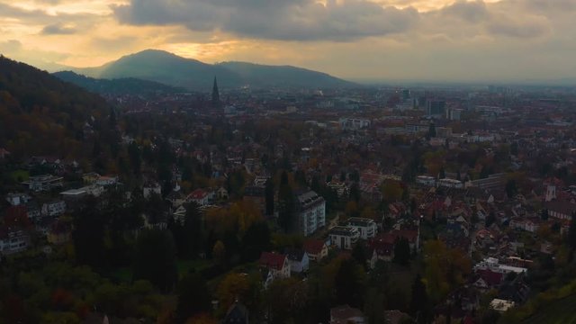Aerial view around the city Freiburg in Germany on a cloudy day, late afternoon in Autumn in the black forest. 