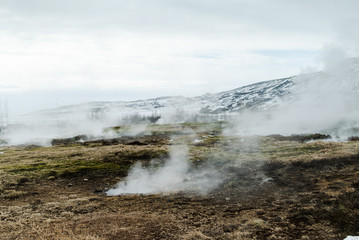 The colorful geyser landscape at the Haukadalur geothermal area, part of the golden circle route, in Iceland