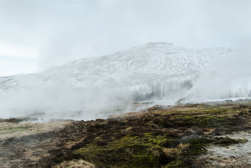 The colorful geyser landscape at the Haukadalur geothermal area, part of the golden circle route, in Iceland