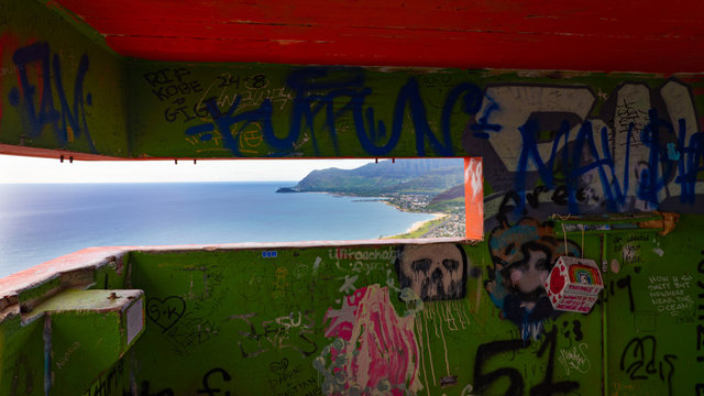 Scenic views of seascapes and mountains of West Oahu from inside WW2 Pillbox atop of the Waianae Mountain ridge. Grafitti painted on the inside walls and with large open dark areas for text