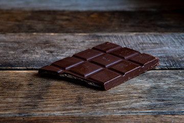 Chocolate with white filling on wooden boards.