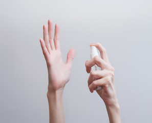 Hands in protective gloves with a syringe and antiseptics