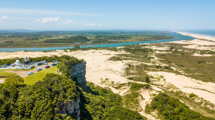 Fototapeta na wymiar Morro dos Conventos - Araranguá - SC. Cliffs ad dunes by the sea in Araranguá - Brazil