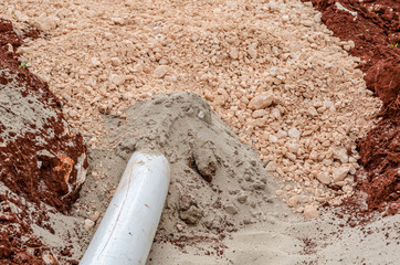 Closeup Of Exiting Pipe From Sand And Marl Packing