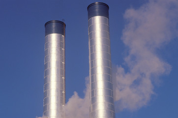 Two smokestacks in industrial America