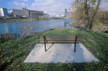 A bench overlooking an industrial park on the Rouge River in Detroit, Michigan