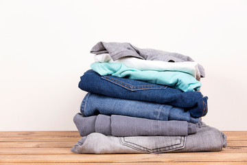 Lots of denim pants, blue and gray
