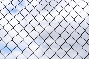 Fototapeta na wymiar Isolated Fence Pattern with Blue Sky Background