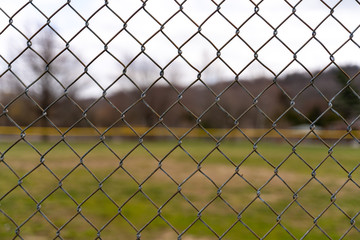 Fence Pattern with Field and Grass in the Background