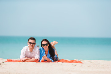 Fototapeta premium Young couple on white beach during summer vacation.