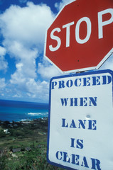 A sign that reads &Ograve;Stop - proceed when lane is clear&Oacute;