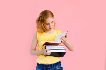 Time to prepare for lessons. Young lovely reader girl holding books in hand and smile isolated on shine pink background