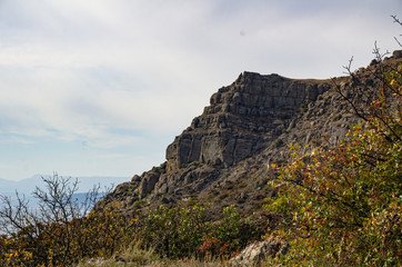 Mountain seascape, sunny day travel, and adventure.