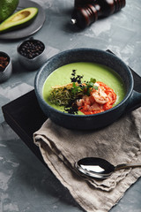 Cream of asparagus soup with shrimp. Green asparagus soup with tiger prawns, Food photo, healthy eating, wholesome food.