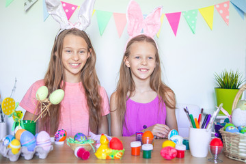 Happy easter. Beautiful little kids wearing bunny ears on Easter day.