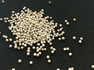 Pepper seeds on a black background