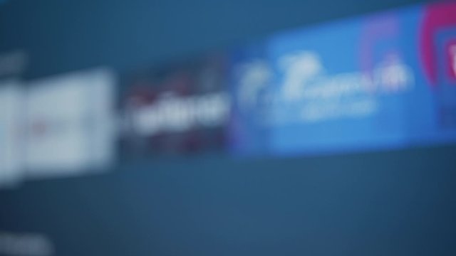 Browsing apps on a Smart TV device - blurry defocused concept video