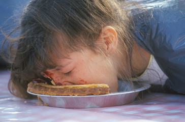 Teenage girl in a pie-eating contest, Knott's Berry Farm, CA