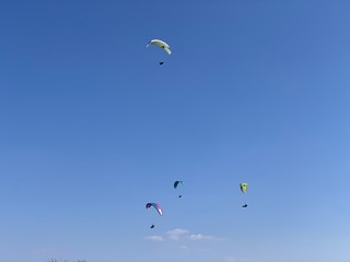 Naklejka na ściany i meble Paragliding fly at Hungary Harmashatar hill