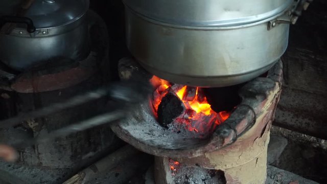 Traditional cooking with charcoal stove Cooking using charcoal stoves is a way of rural people.
