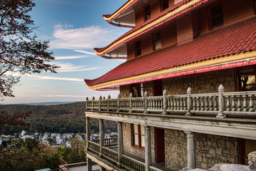 Side view of the Reading Pagoda in daytime with the city far below