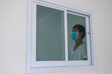 Man in isolation at home for coronavirus outbreak (COVID-19), Quarantine to prevent the spread of...