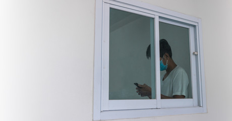 Man in isolation at home for coronavirus outbreak (COVID-19), Quarantine to prevent the spread of the coronavirus (COVID-19)