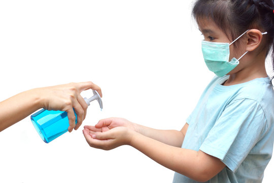A girl using alcohol gel and wearing medical mask to prevent communicable disease isolated on white / Wuhan Coronavirus prevention concept