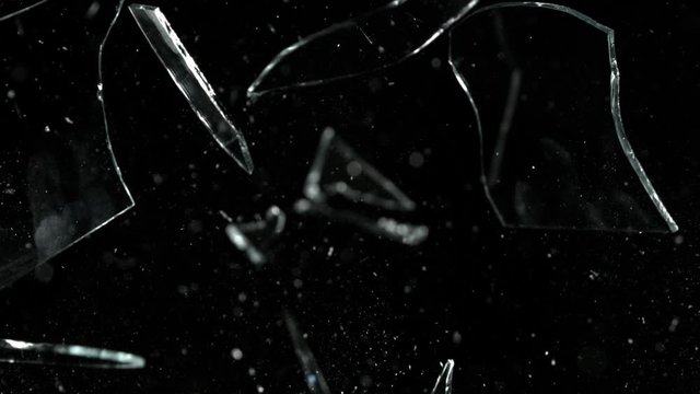 Super Slow Motion Shot of Real Glass Break at 1000 fps Isolated on Black Background.