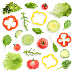 Set of different vegetables and herbs on white background, top view. Fresh ingredients for salad