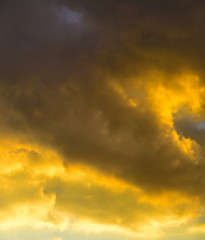 Beautiful puffy clouds at sunset isolated against pastel blue skies