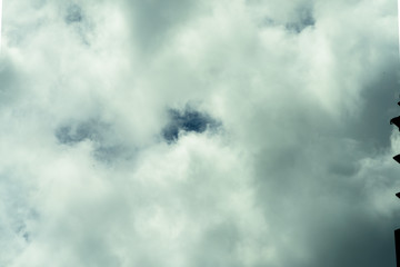 Beautiful puffy clouds at sunset isolated against pastel blue skies