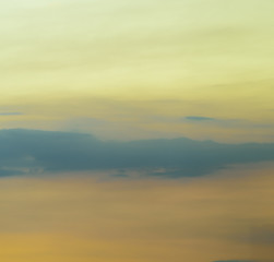 Beautiful puffy clouds at sunset isolated against pastel blue skies