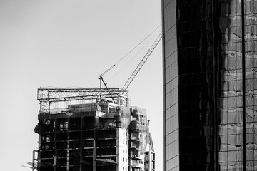 Construction crane on high rise building