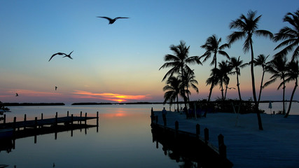 Fototapeta na wymiar Small beautiful pier in the Keys of Florida at sunset